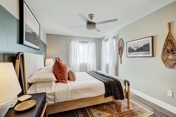 Bedroom featuring modern decor and natural light at Habitat at Fort Collins luxury apartments