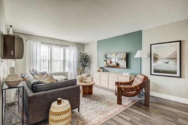 Spacious living room with modern decor in Habitat at Fort Collins luxury apartments