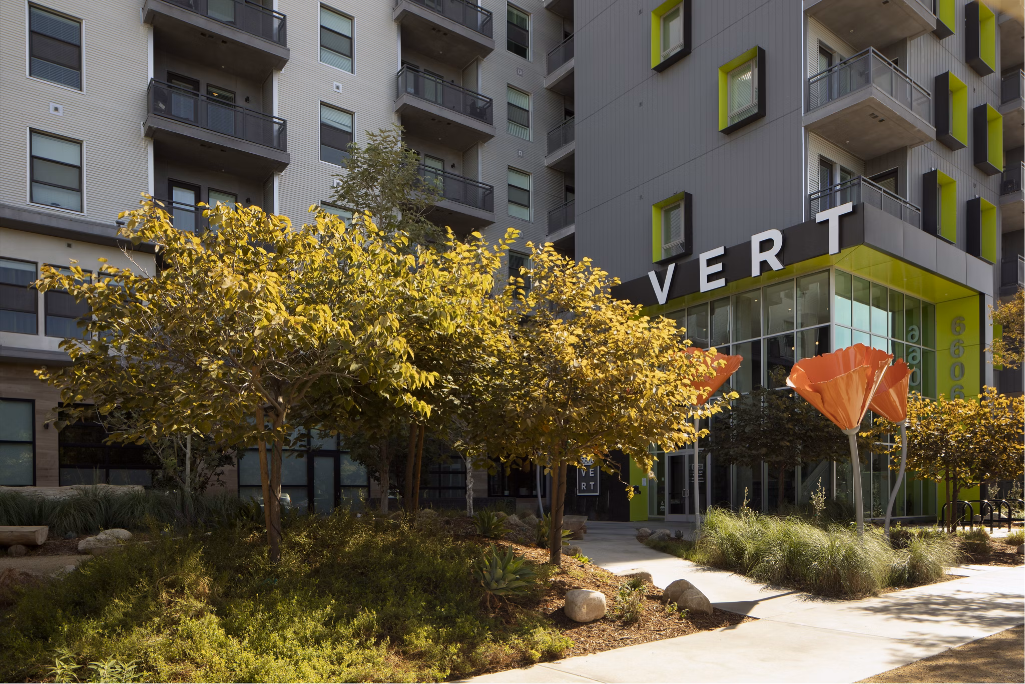 Vert Apartments: Luxury high-rise overlooking city skyline in vibrant urban neighborhood
