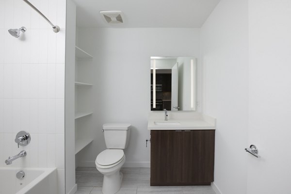 Bathroom featuring modern design and sleek fixtures at Vert Apartments