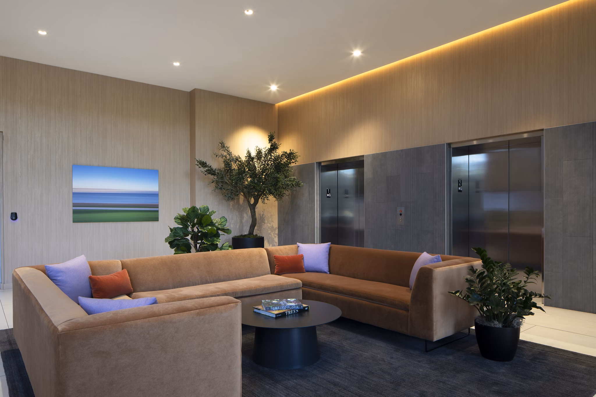 Modern clubhouse at Vert Apartments featuring luxury seating areas and vibrant decor, perfect for social gatherings and community events