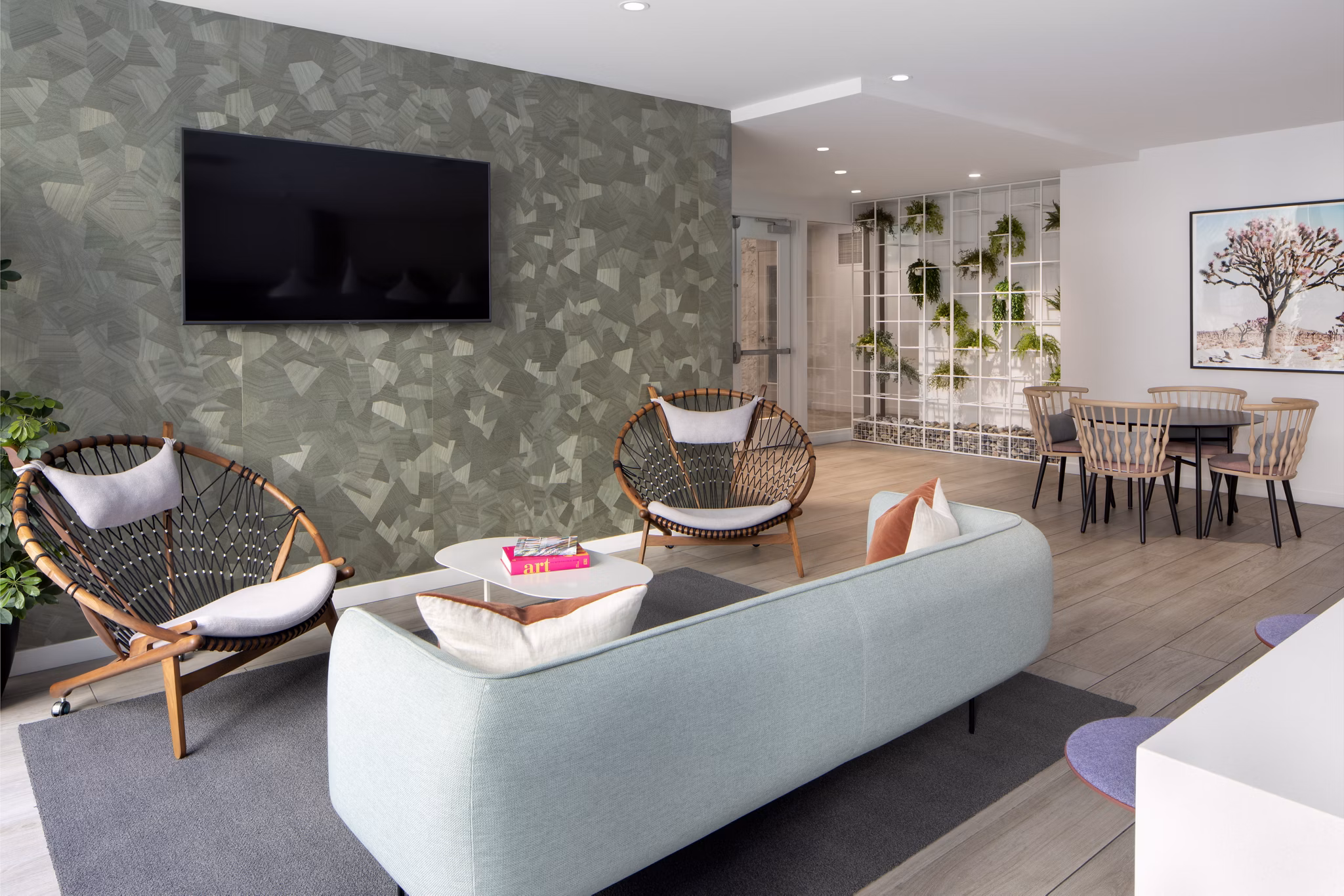 Clubhouse with modern design and cozy seating at Vert Apartments, luxury living by Greystar in a vibrant community