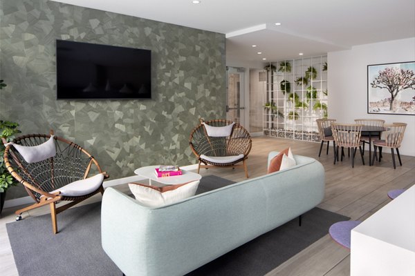 Clubhouse with modern design and cozy seating at Vert Apartments, luxury living by Greystar in a vibrant community