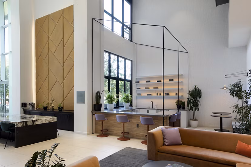 Elegant clubhouse with modern seating and lush decor at Vert Apartments, Greystar luxury community