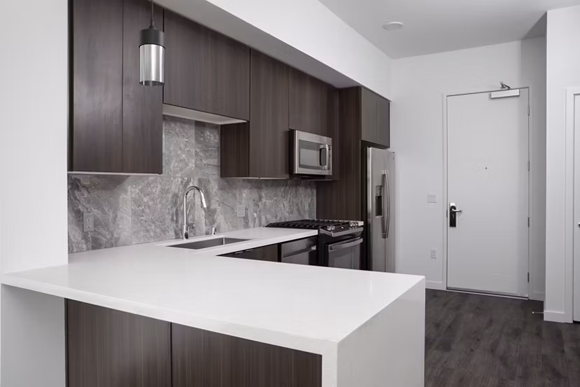 Modern kitchen with stainless steel appliances at Vert Apartments
