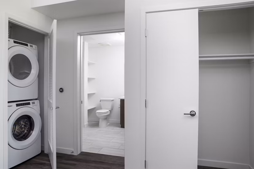 Laundry room with modern appliances at Vert Apartments in Los Angeles luxury community