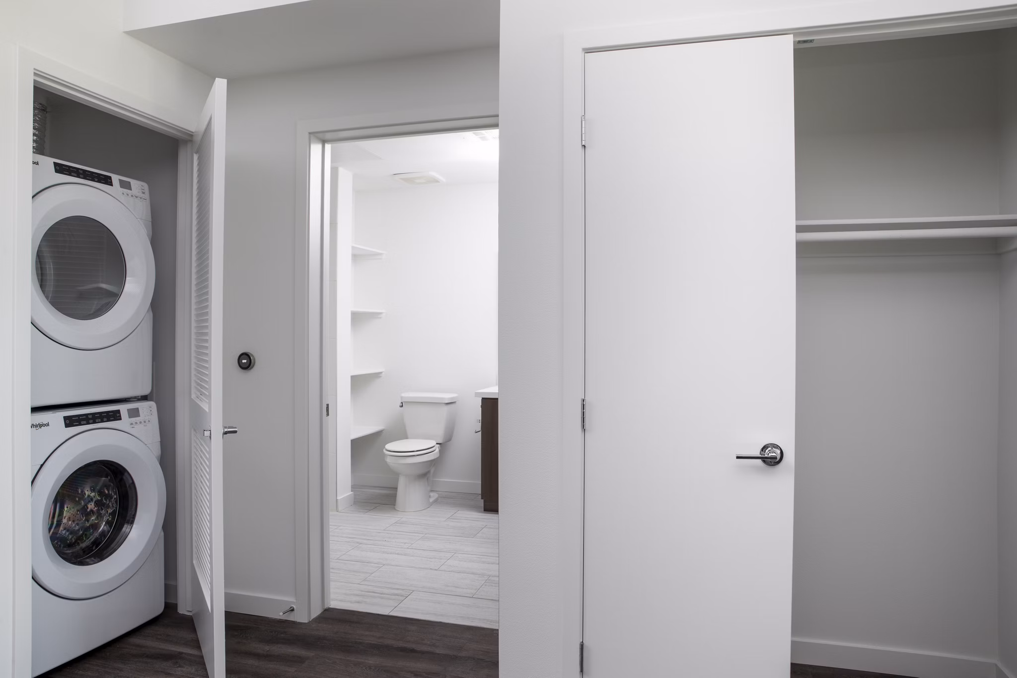 Laundry room with modern appliances at Vert Apartments in Los Angeles luxury community