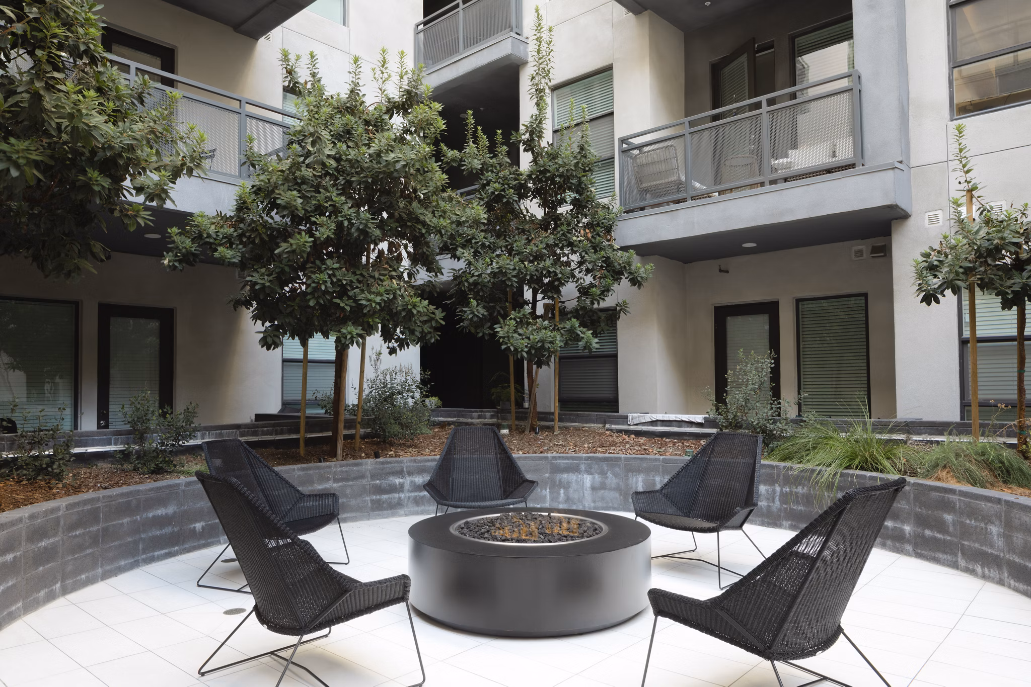 Cozy fire pit with seating area at Vert Apartments in the Greystar luxury community