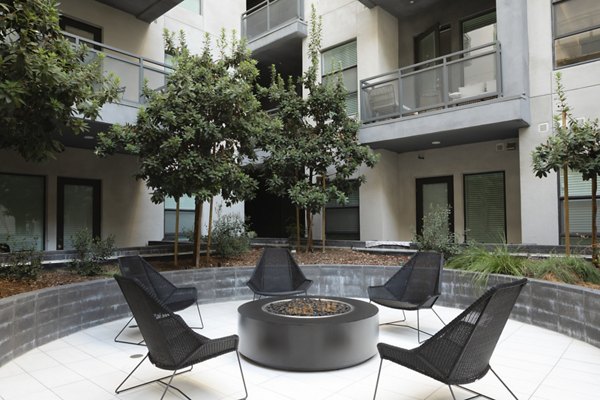 Cozy fire pit with seating area at Vert Apartments in the Greystar luxury community