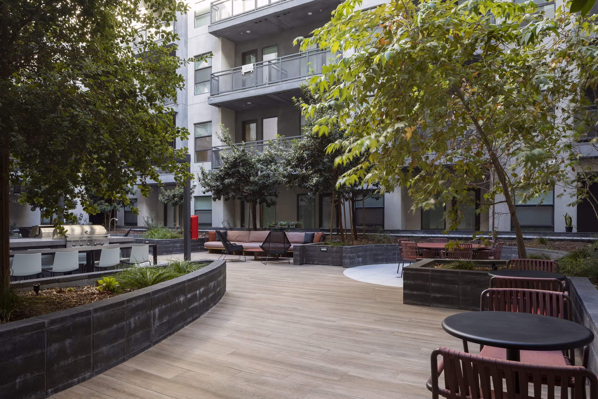 Courtyard at Vert Apartments: Lush greenery and seating area in luxury apartment community