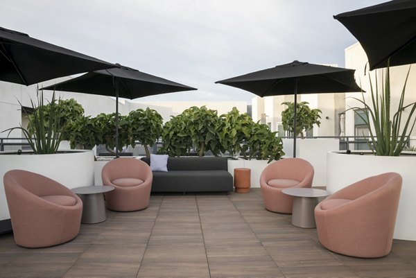 Vert Apartments: Lush courtyard with scenic landscape views at luxury apartments in vibrant city setting