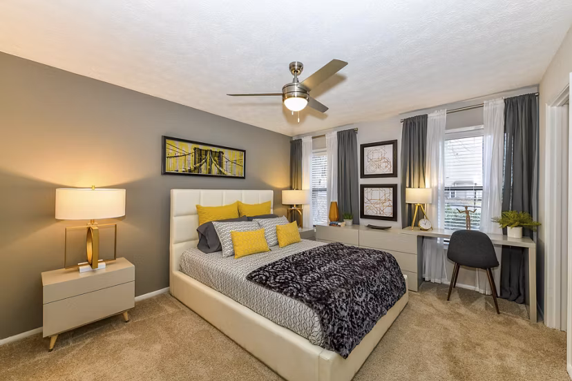 Spacious bedroom with modern decor at Avana Powers Ferry Apartments in Atlanta, featuring large windows and ample natural light