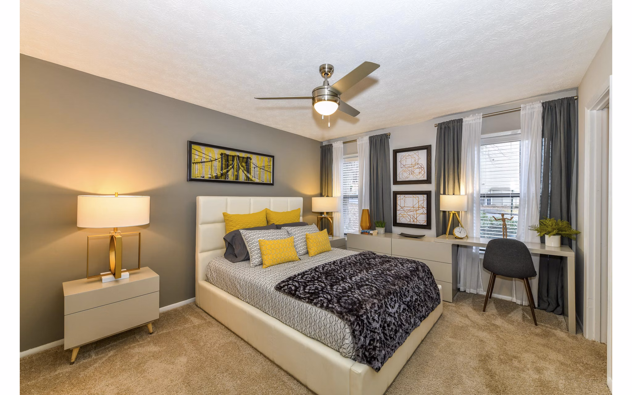 Spacious bedroom with modern decor at Avana Powers Ferry Apartments in Atlanta, featuring large windows and ample natural light