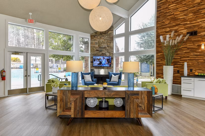 Clubhouse with lounge seating and pool table at Avana Powers Ferry Apartments