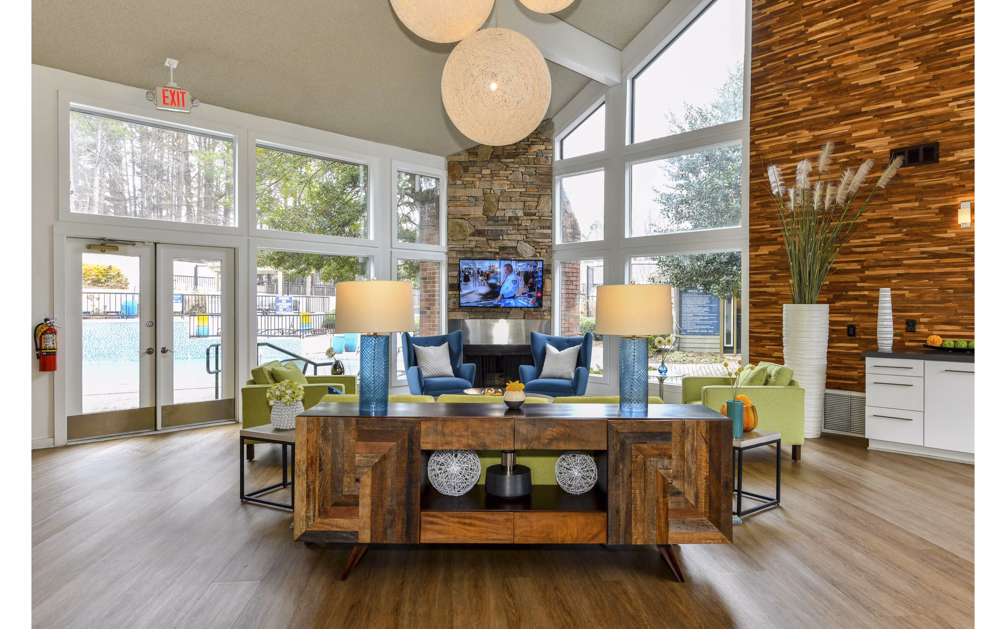 Clubhouse with lounge seating and pool table at Avana Powers Ferry Apartments