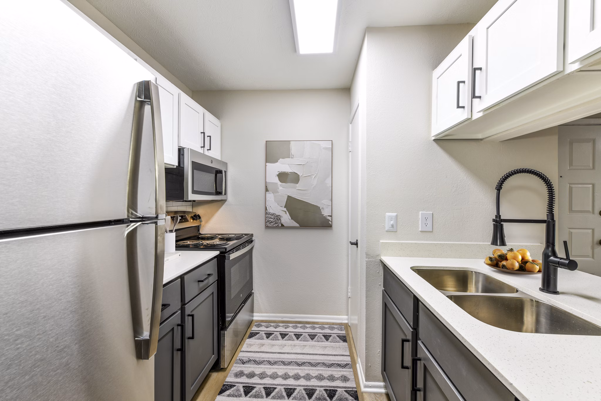 Modern kitchen with stainless steel appliances at Avana Powers Ferry Apartments