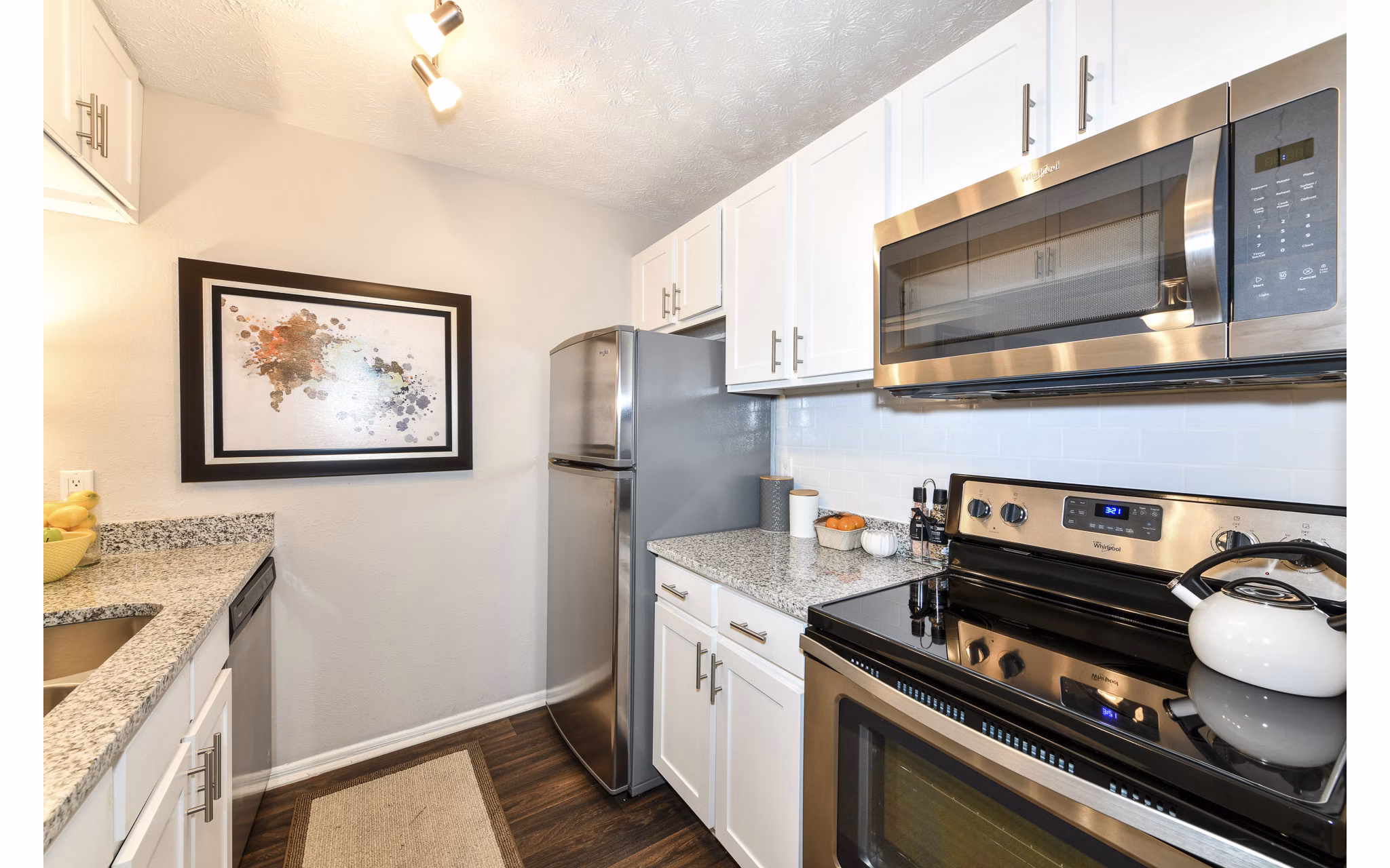Modern kitchen with stainless steel appliances in Avana Powers Ferry Apartments