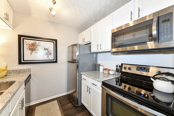 Modern kitchen with stainless steel appliances in Avana Powers Ferry Apartments