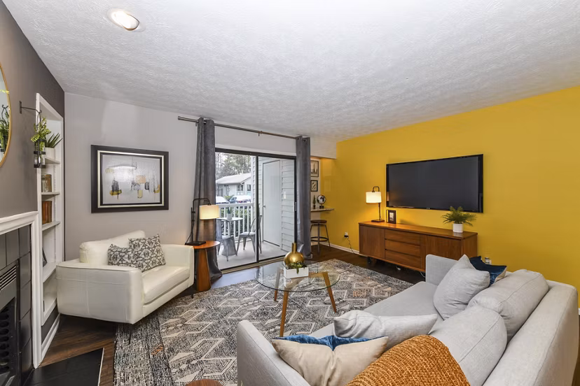 Modern living room featuring cozy seating and large windows in Avana Powers Ferry Apartments, perfect for luxury living