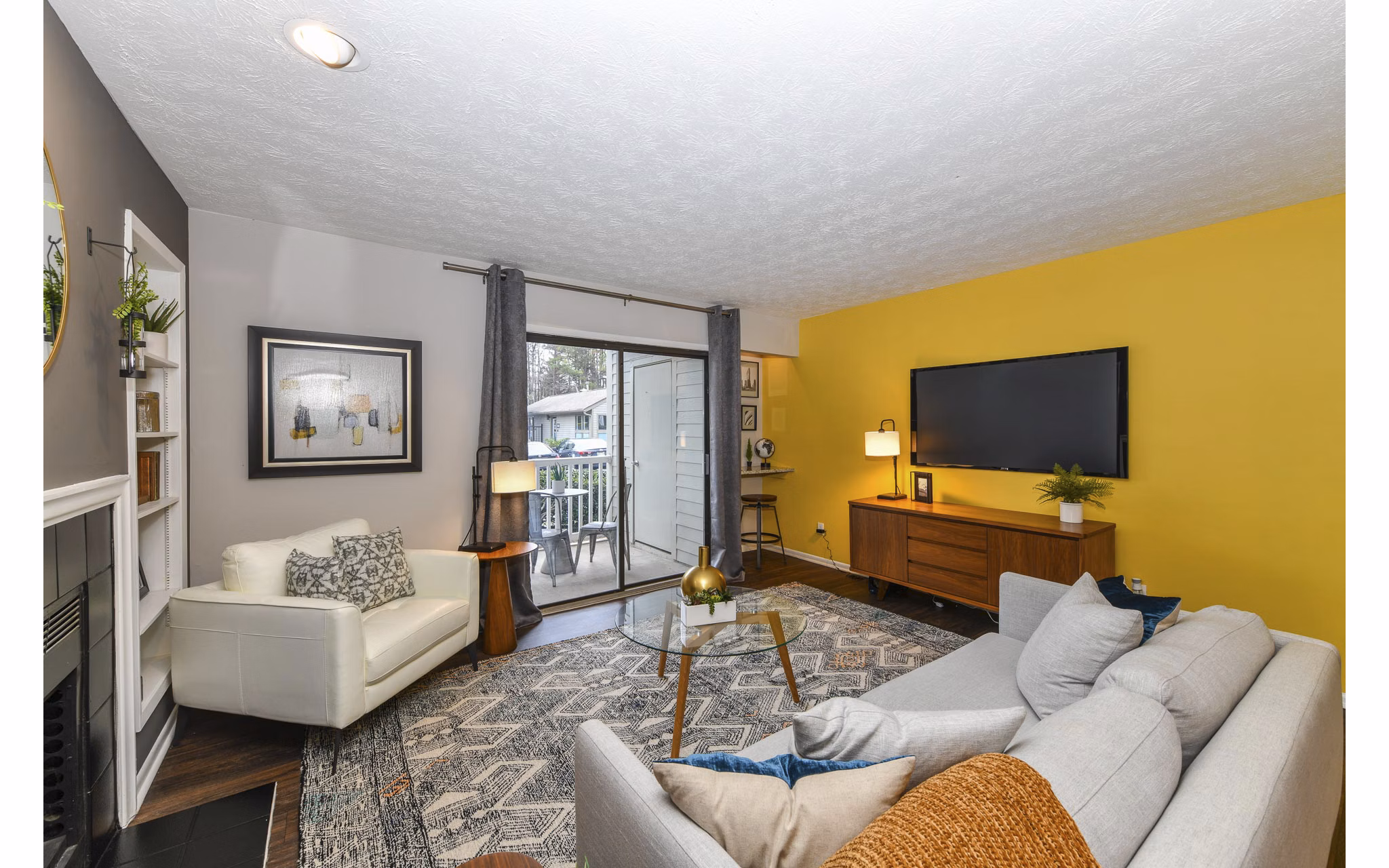 Modern living room featuring cozy seating and large windows in Avana Powers Ferry Apartments, perfect for luxury living
