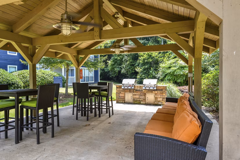 Outdoor grill area with modern barbeque facilities at Avana Powers Ferry Apartments, offering a perfect spot for social gatherings