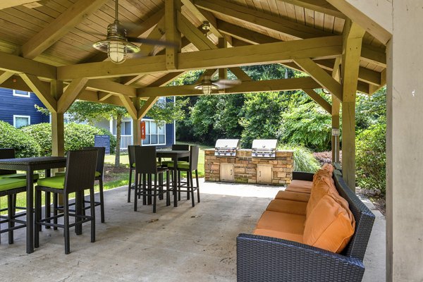Outdoor grill area with modern barbeque facilities at Avana Powers Ferry Apartments, offering a perfect spot for social gatherings