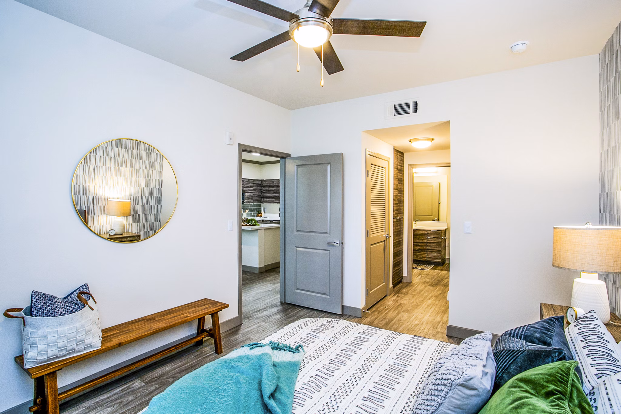 Cozy bedroom with modern decor at The Alcove Apartments