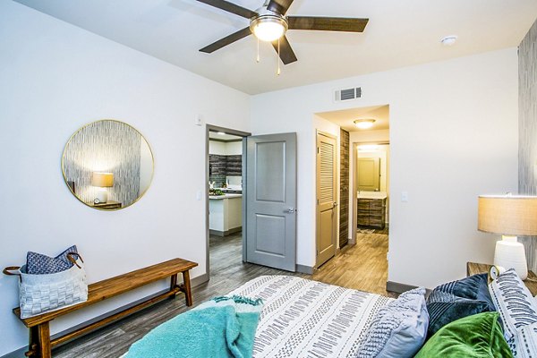 Cozy bedroom with modern decor at The Alcove Apartments