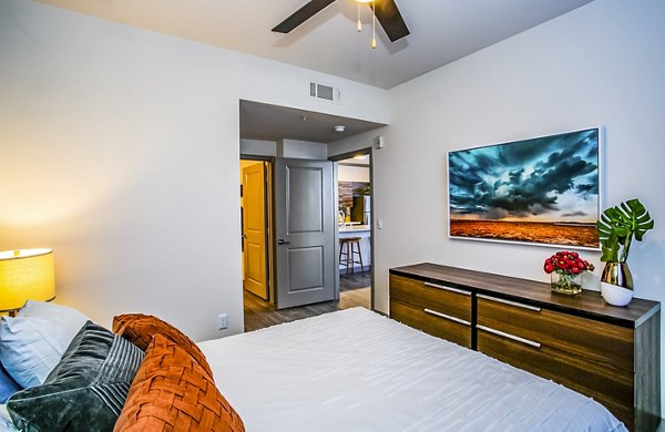 Modern bedroom with elegant decor at The Alcove Apartments, luxury living by Greystar