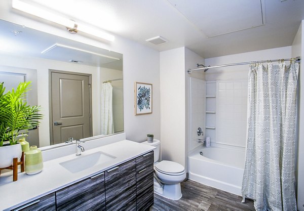 Bathroom with modern fixtures and sleek design at The Alcove Apartments