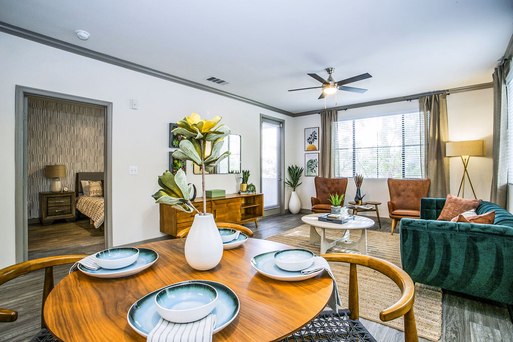 Dining room at The Alcove Apartments featuring elegant table setting and modern lighting fixtures