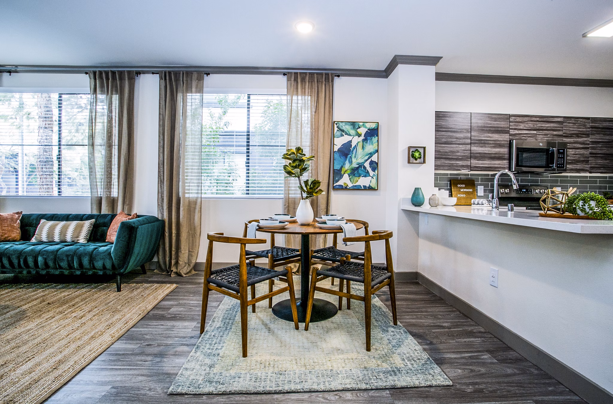 Dining room with elegant decor and modern furnishings at The Alcove Apartments, luxury living by Greystar in a premium location