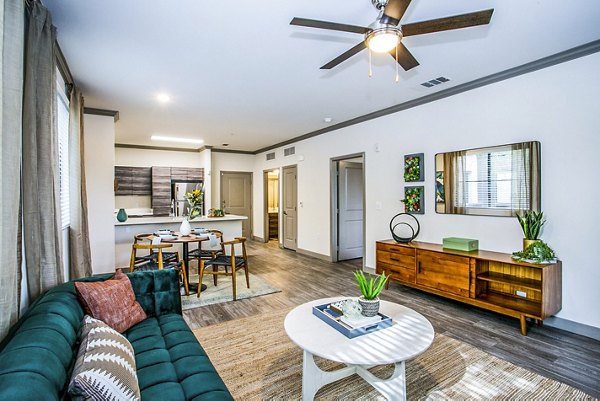 Cozy living room with modern decor at The Alcove Apartments