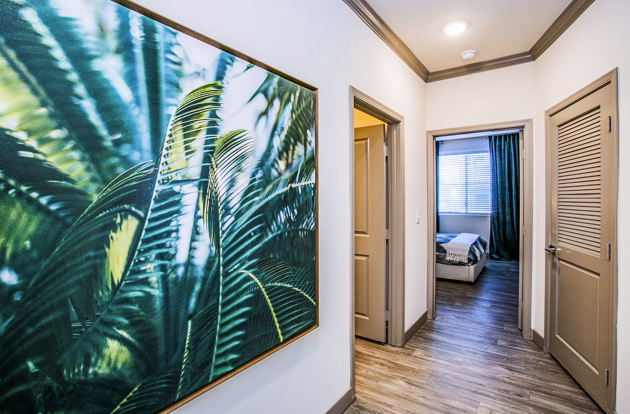 Stylish hallway with modern lighting at The Alcove Apartments in luxury Greystar community