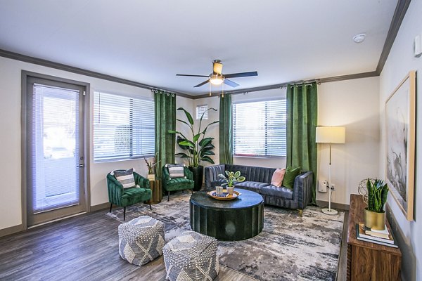 Modern living room with elegant furnishings at The Alcove Apartments, highlighting luxury in urban living spaces