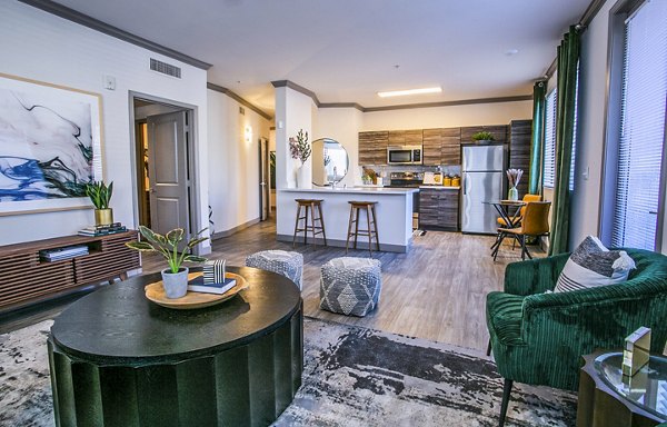 Modern living room with sleek furnishings at The Alcove Apartments, showcasing luxury living in a Greystar community