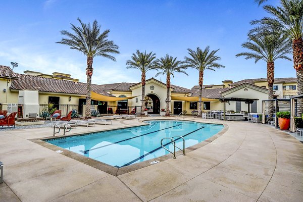 Resort-style pool at The Alcove Apartments with lounge chairs