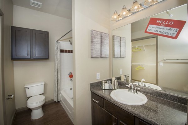 Modern bathroom with sleek fixtures at The Highline Apartments, offering luxury living in a stylish setting