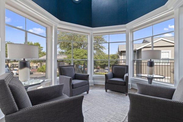 Clubhouse lobby featuring modern dÃ©cor and seating areas at The Highline Apartments