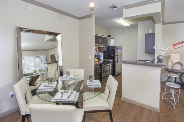 Dining room featuring elegant lighting and modern furnishings at The Highline Apartments