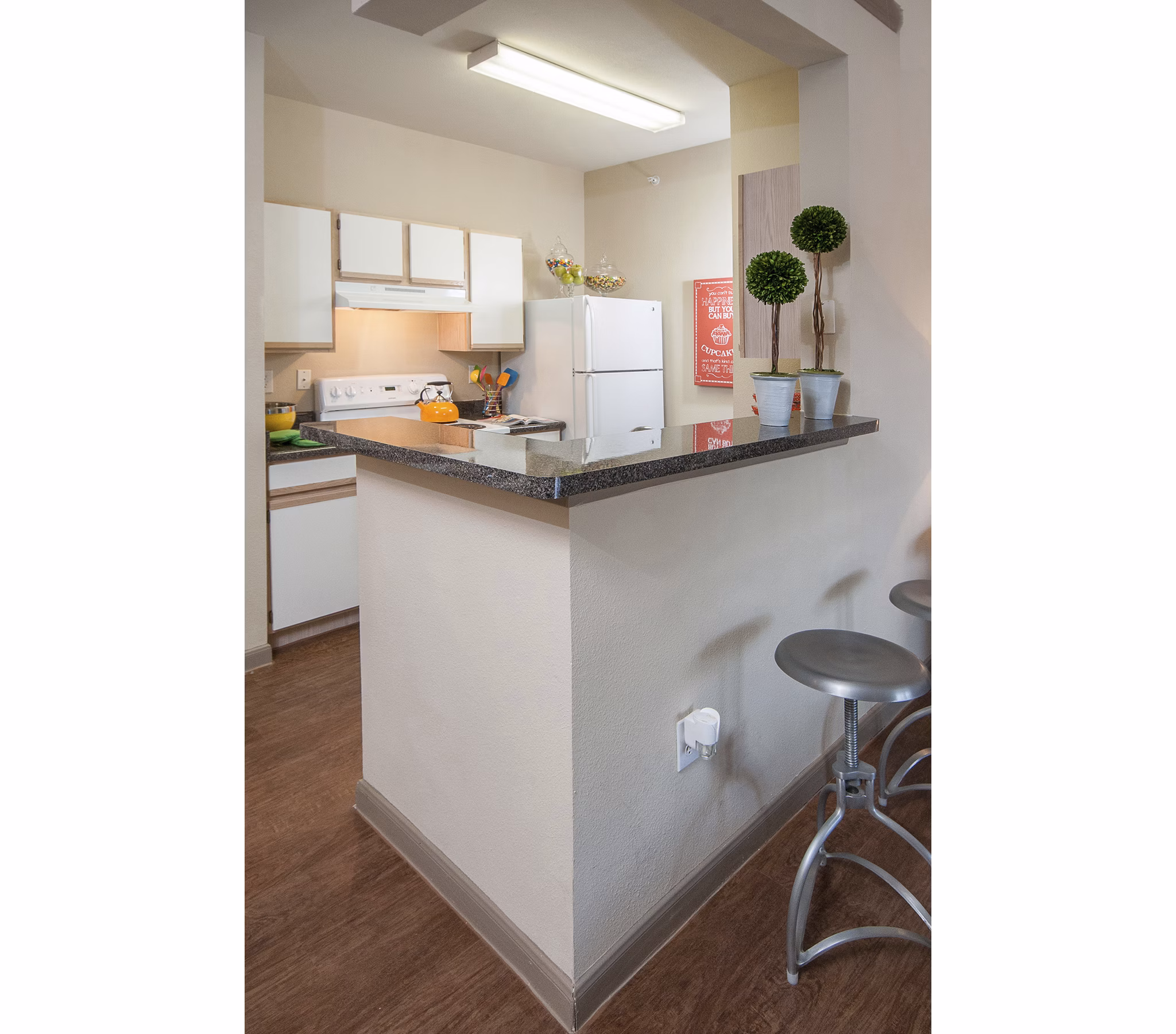 Spacious kitchen with modern appliances and sleek countertops at The Highline Apartments, offering luxury living experiences