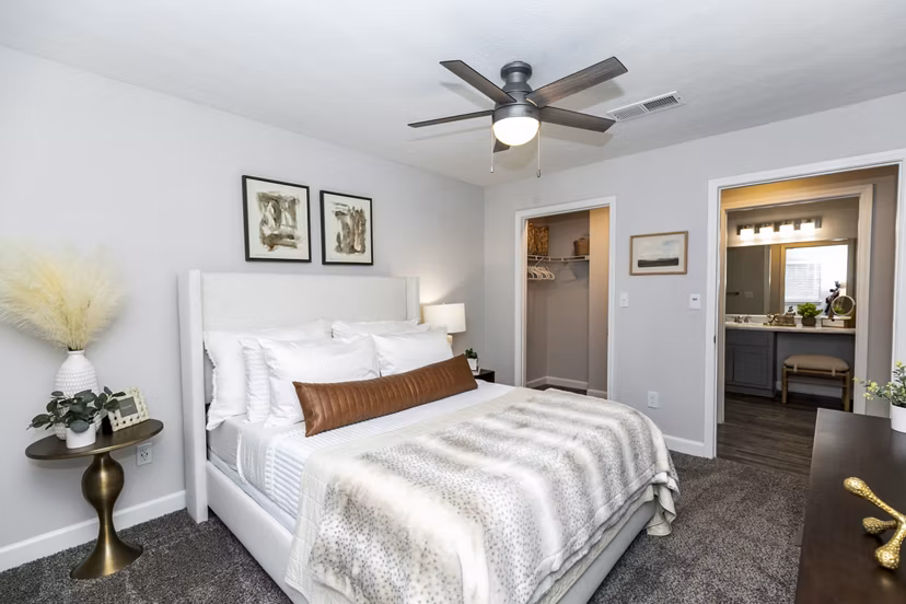 Cozy bedroom with stylish decor at Champions Glen Apartments