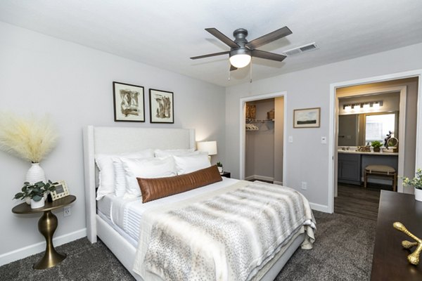 Cozy bedroom with stylish decor at Champions Glen Apartments