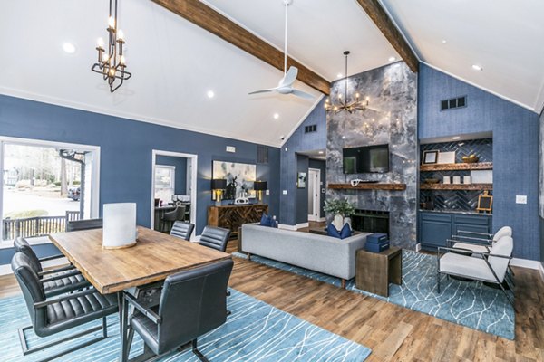 Clubhouse featuring modern furnishings and social spaces at Champions Glen Apartments