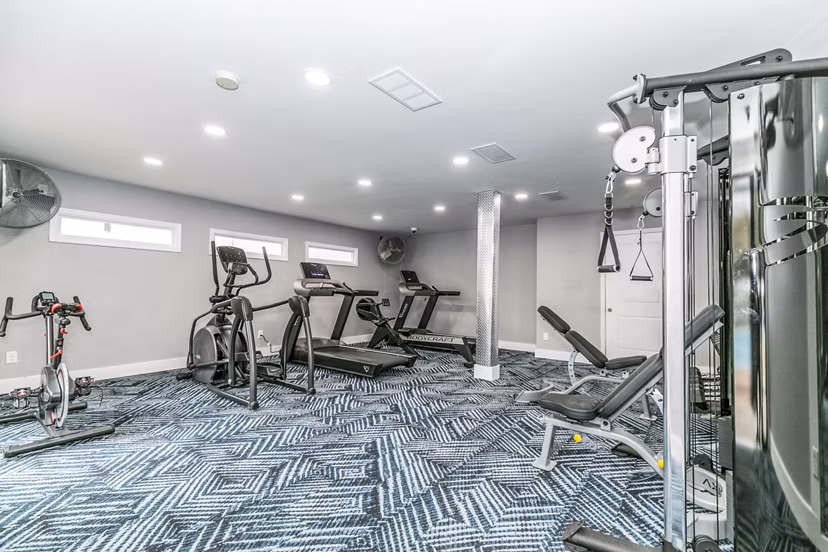 Modern fitness center with state-of-the-art equipment at Champions Glen Apartments
