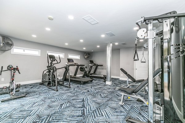 Modern fitness center with state-of-the-art equipment at Champions Glen Apartments
