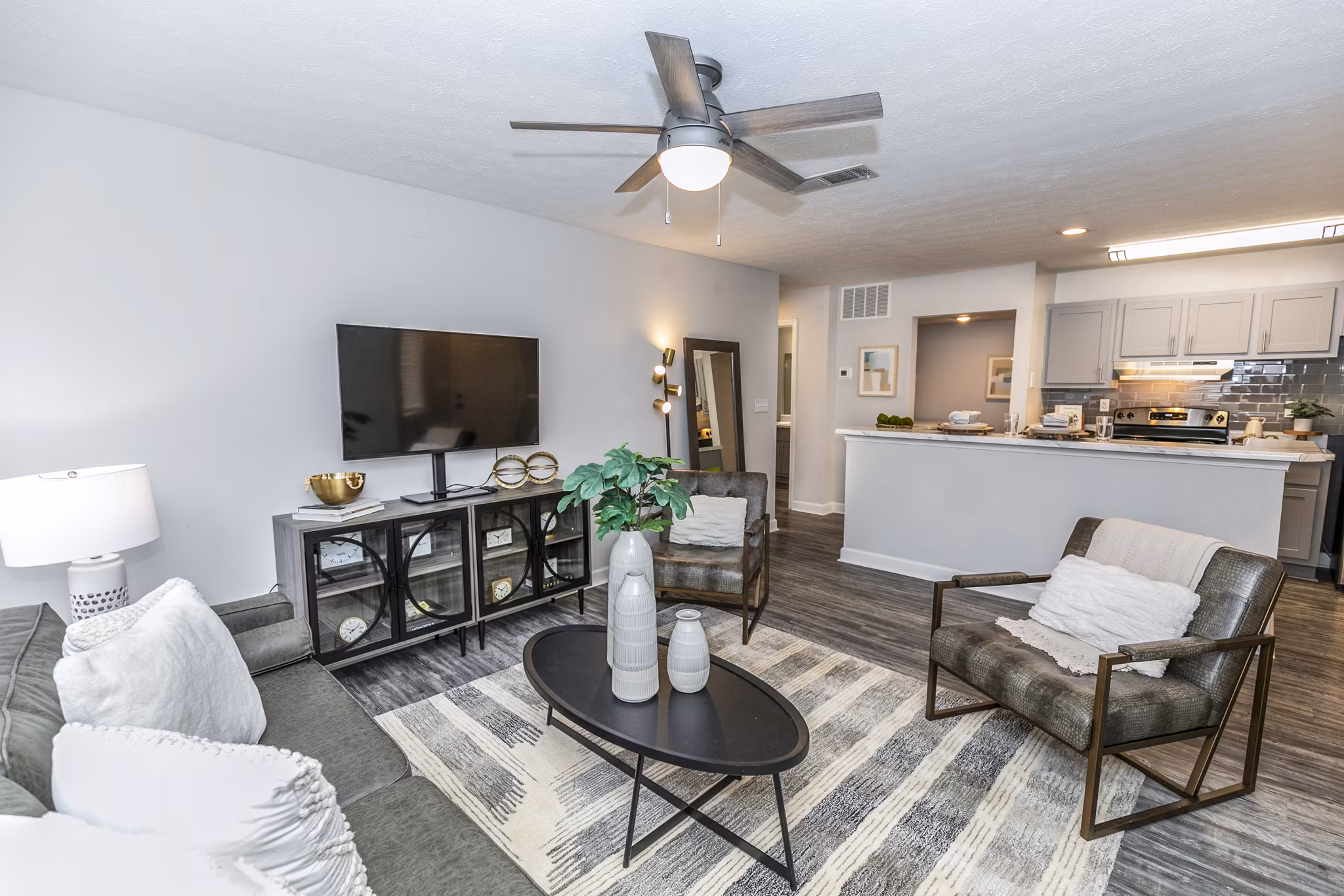 Spacious living room with modern decor at Champions Glen Apartments