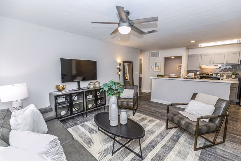 Spacious living room with modern decor at Champions Glen Apartments