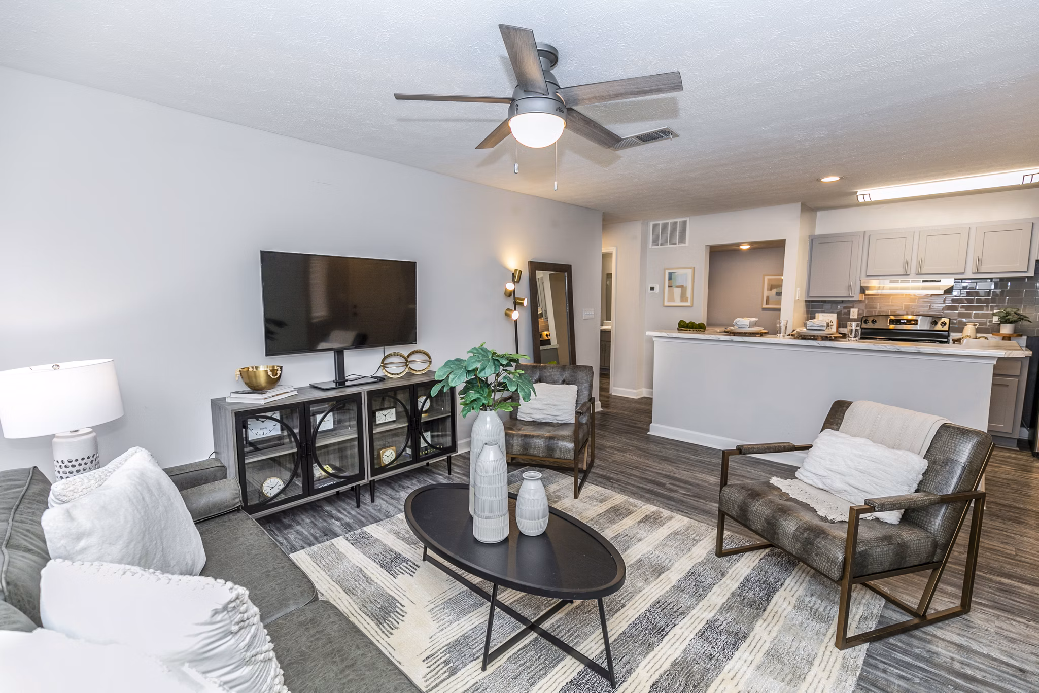 Spacious living room with modern decor at Champions Glen Apartments