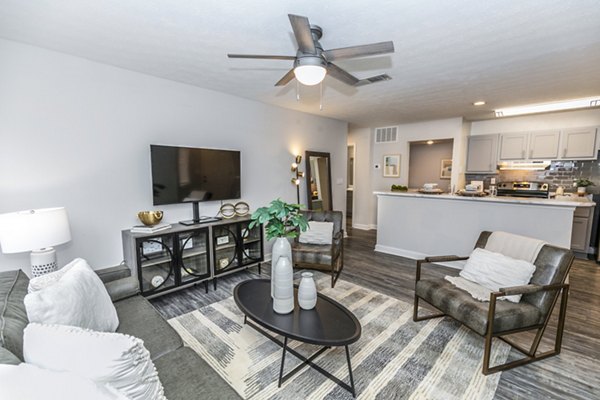 Spacious living room with modern decor at Champions Glen Apartments